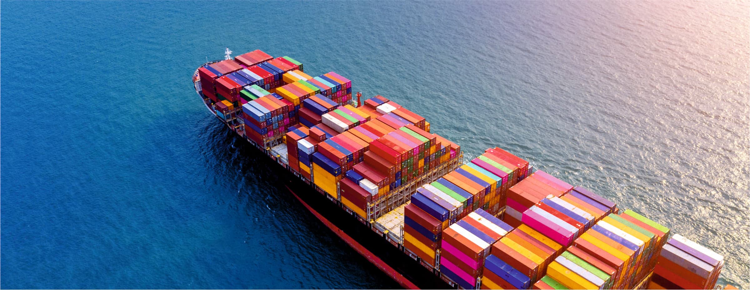 Aerial view of a loaded container vessel at sea