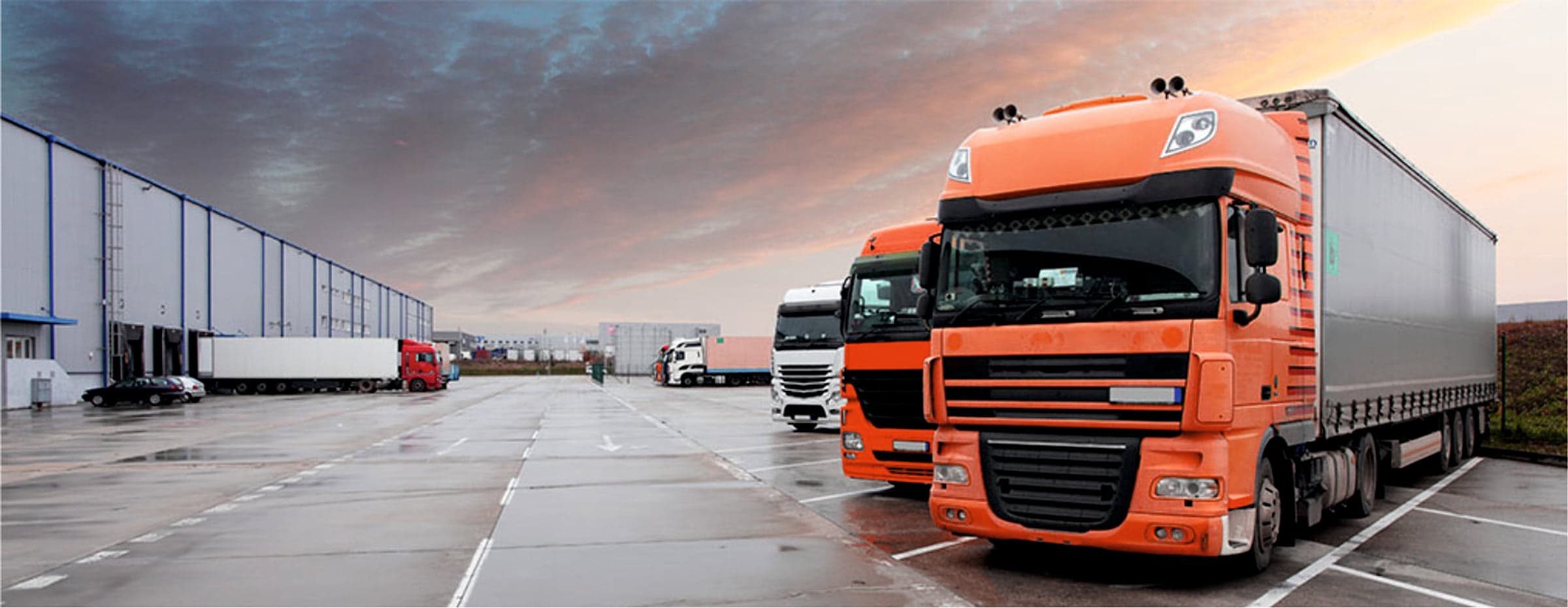 Trucks lined up at warehouse loading docks
