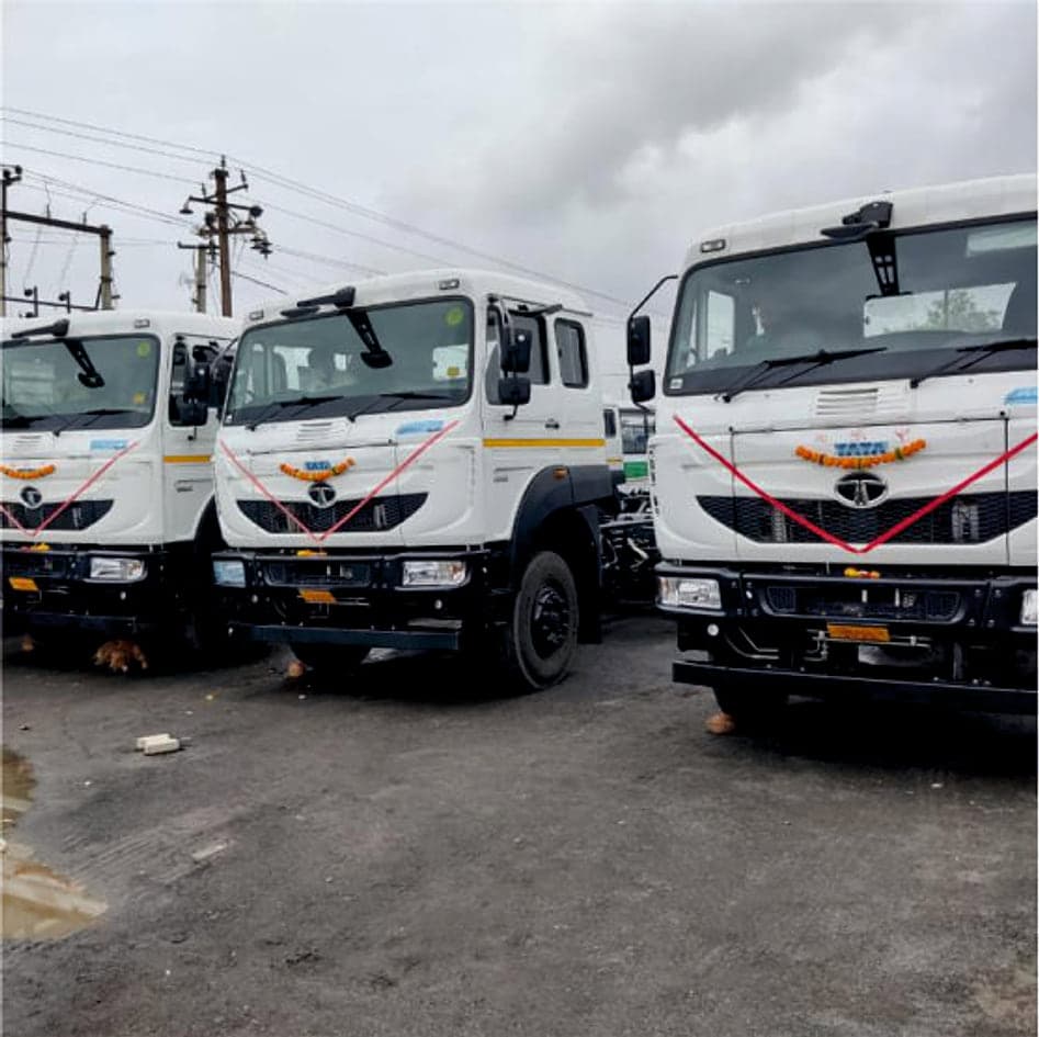 Three new fleet trucks lined up at handover