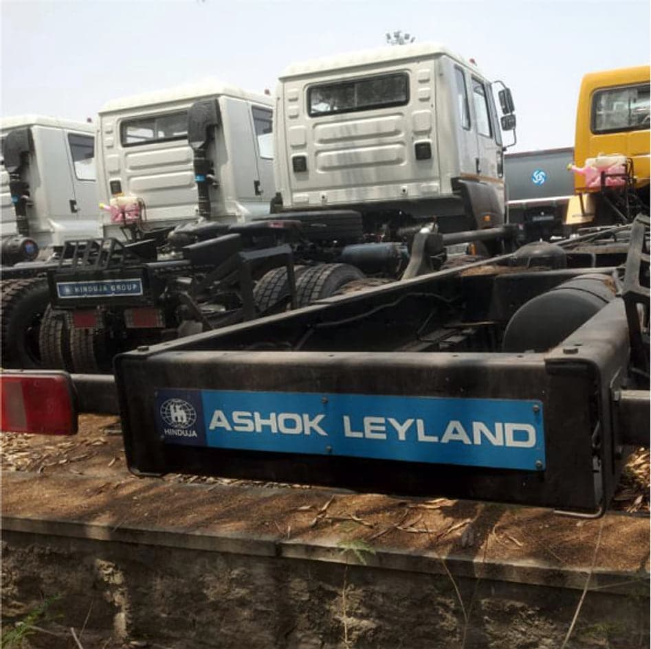 Truck chassis lined up in the yard