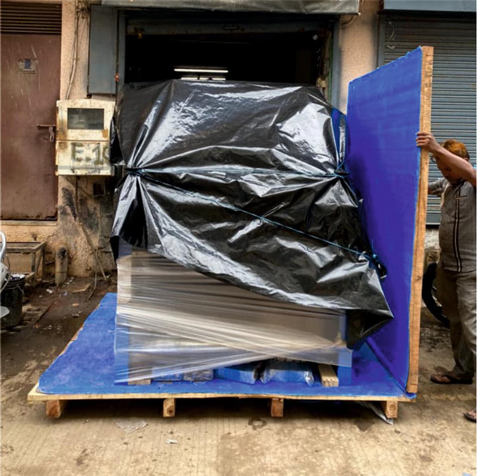 Tarpaulin-covered crate on a pallet at the packing bay