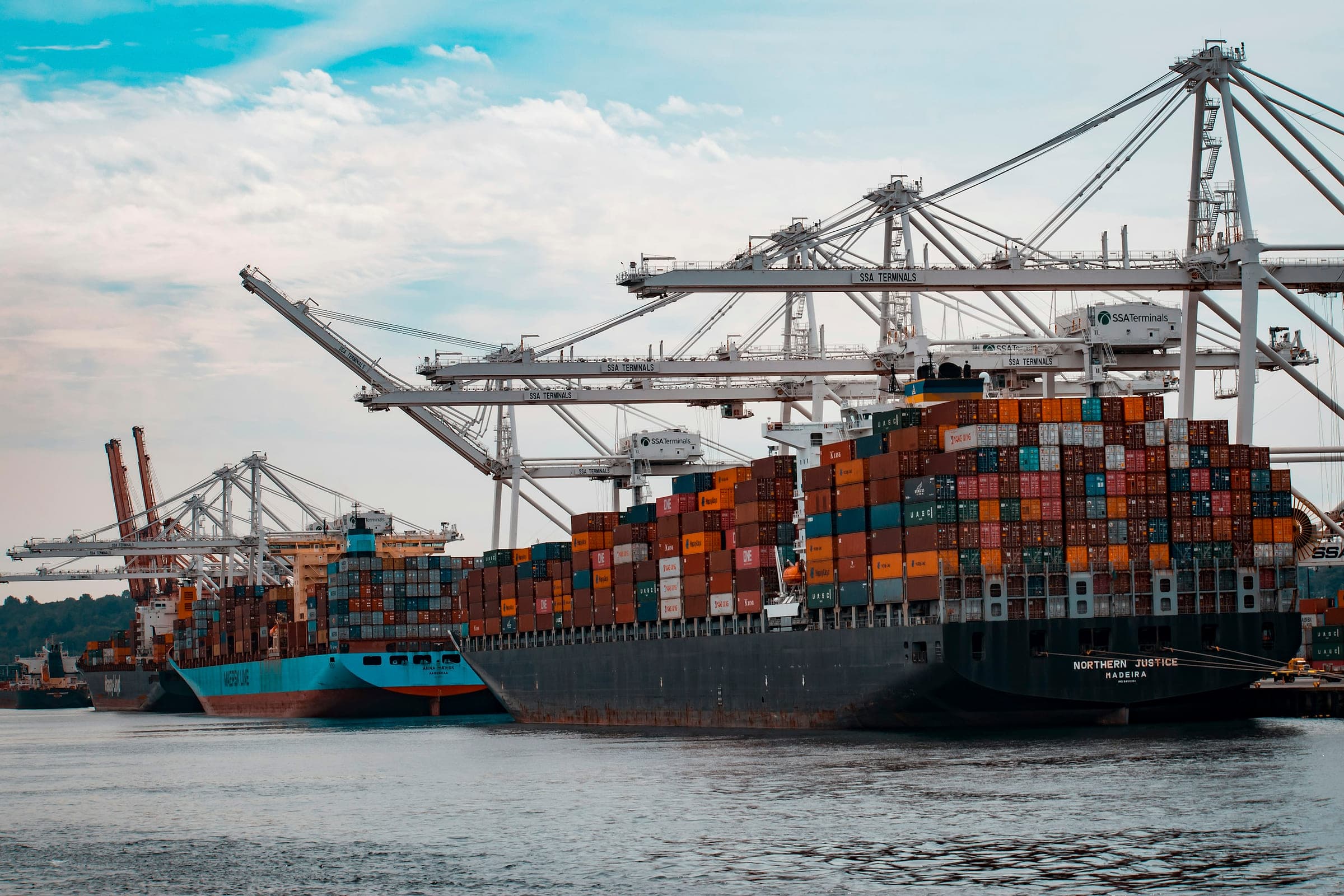 Container vessels at berth under gantry cranes