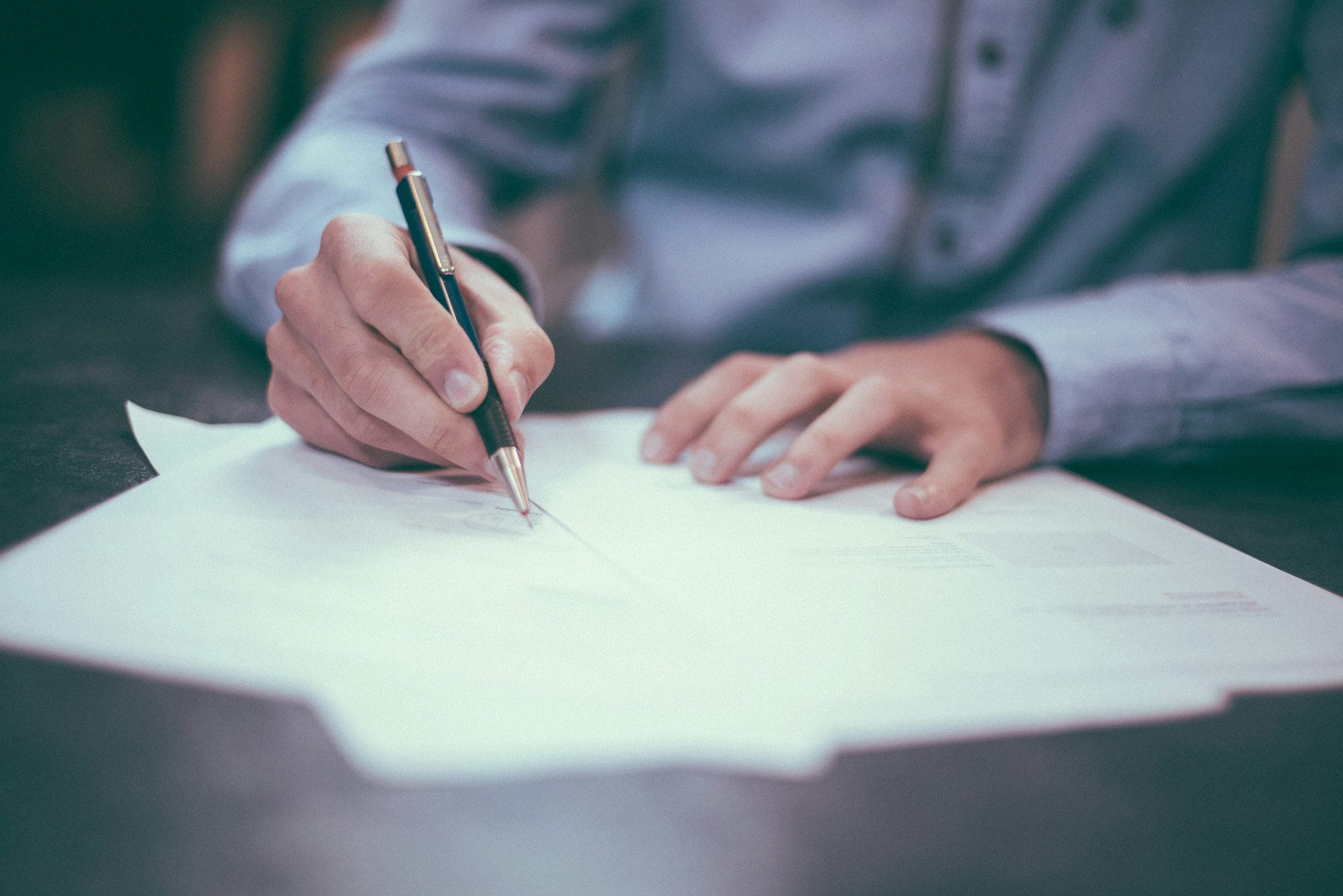 A shipping document being signed at the desk